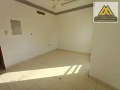 A great opportunity for annual rent in Al Rashidiya, Ajman. This spacious two-bedroom apartment offe
