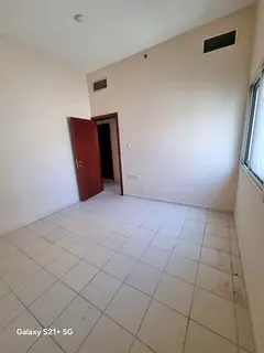 For rent in Al Qasimia Sharjah two bedroom apartment with hall 2 bathrooms kitchen central AC and ce