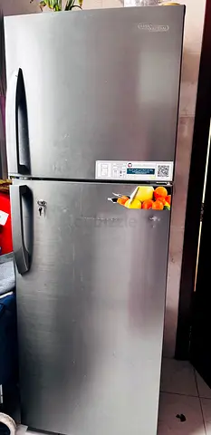 Used top-freezer refrigerator - stainless steel finish, good condition