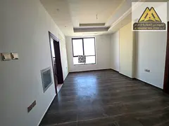 A modern apartment with high-end finishes and a spacious layout, featuring a master bedroom, built-i