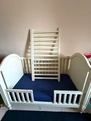 White wooden convertible baby crib / toddler bed (used) plus mattress