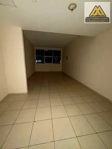 Large studio apartment with a semi\ separate kitchen\ and central air conditioning\ close to all amenities \Easy access to Dubai and Sharjah
