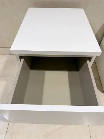 White bedside nightstand with storage drawer