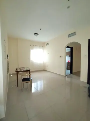 For annual rent in cooperation with Sharjah: A one-bedroom apartment with a living room and balcony