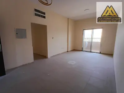 A one-bedroom apartment for annual rent in Al Rashidiya 2, Ajman, featuring a balcony, spacious layout, central AC, free maintenance, and a prime loca