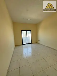 A large room and living room with a balcony and a good view.