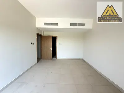Two-bedroom apartment with a living room for annual rent in Al Zahia, Ajman (Kentia Residence – Uptown), first occupant, within a modern residential c