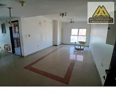 For rent: 2-bedroom apartment with hall in Al Rashidiya 3. 2 bathrooms, balcony, parking, wardrobes,