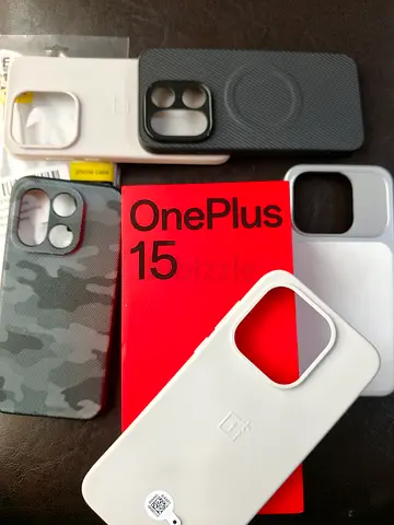 OnePlus 15 box with multiple phone cases - used (collection)