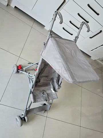 Lightweight grey umbrella stroller with sun canopy