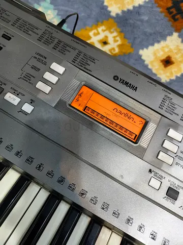 Yamaha PSR-E353 portable keyboard features 61 touch-responsive keys