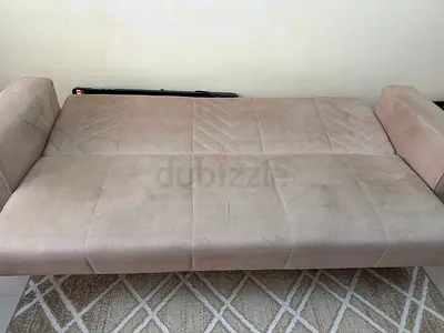 Beige 3 seater convertible sofa bed with storage + single seater in good condition with coffee table