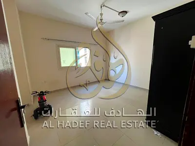 One Bedroom Apartment for Annual Rent in Al Bu Tina with Balcony Open View Hallway Two Bathrooms Central AC and Central Gas