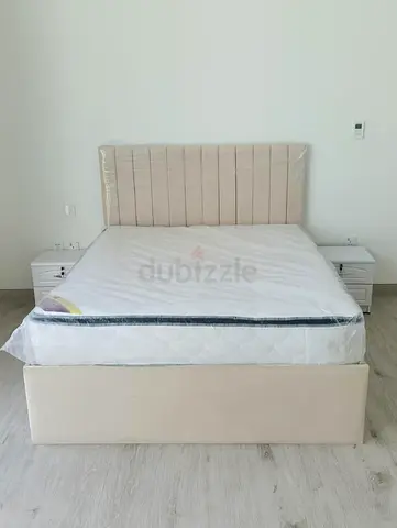 Queen upholstered bed frame with headboard and storage base - beige