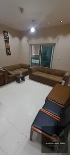 Two bedrooms and a living room with furniture for annual rent in City Towers with a balcony, opposit