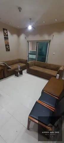 Two bedrooms and a living room with furniture for annual rent in City Towers with a balcony, opposi