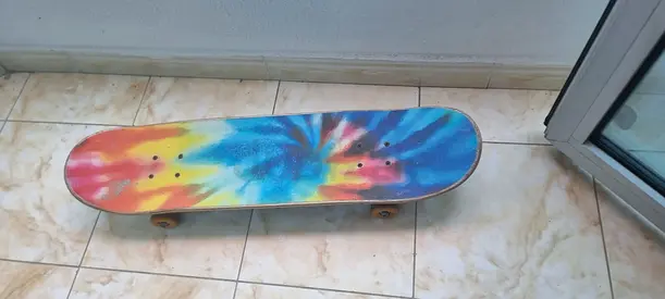Used tie-dye skateboard - complete, good condition