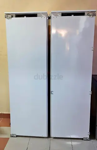 Smeg built-in fridge freezer set, featuring a white finish.They are designed for seamless integratio