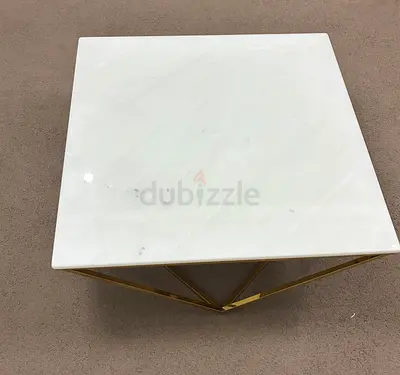 Square white marble side table with gold geometric base