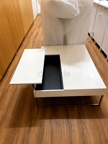 Boconcept White modern coffee table with sliding top and storage