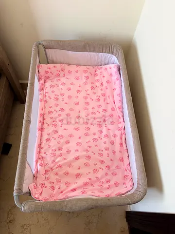 Lightweight beige baby bassinet - good condition
