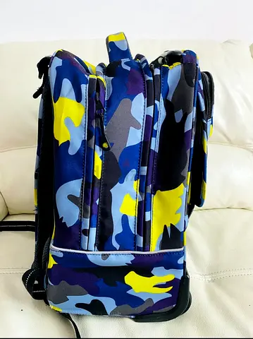 Delsey Blue  Yellow Camo Backpack — Good Condition, Multiple Compartments