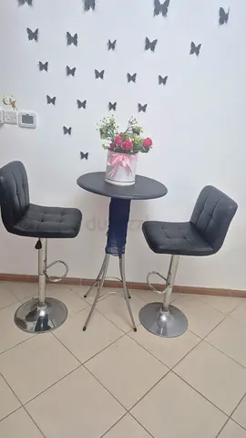 Modern Bar Table and Two Black Swivel Bar Stools
