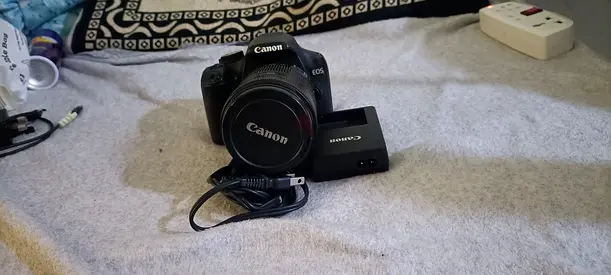 Canon EOS DSLR with lens and charger - good working condition
