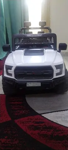 White ride-on toy truck for kids — battery powered