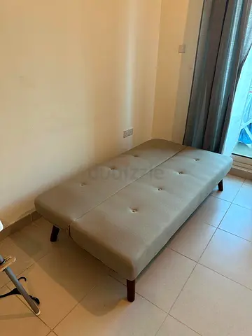 Compact beige convertible daybed / futon couch — excellent condition