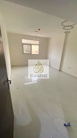 Annual rent in Ajman, Al Jurf 3 area, next to the Tribes Center and Woodlam Park School. The building is for families and features two bedrooms, a liv