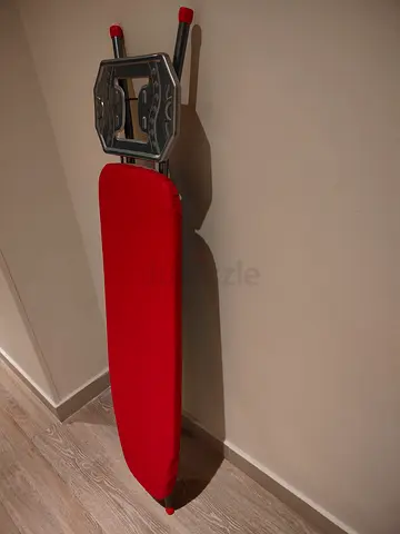 Compact ironing board with red cover - good condition