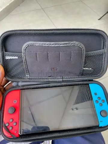 Nintendo Switch oled console with travel case (neon red/blue Joy-Con)