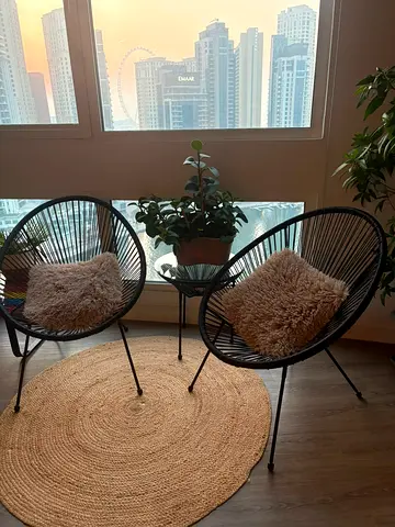 Pair of Black Outdoor/Indoor Acapulco Style Wicker Chairs with Cushions, table ad carpet