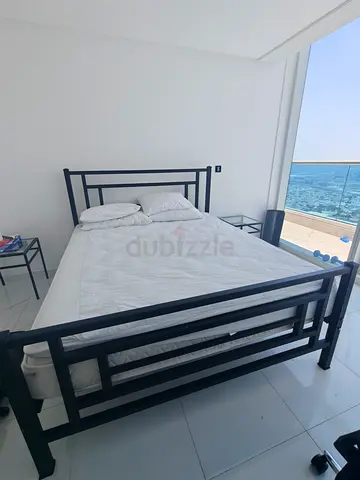 Black Metal King Bed Frame with High Quality Serta Mattress and 2 night stands -$% Condition