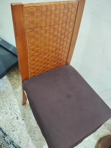 Pair of wooden chairs with rotating glass-top coffee table - good condition