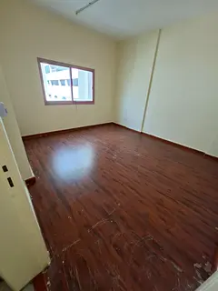 For rent in Al Majaz 1: 2BR apartment with hall, master room, storage room, balcony, central AC, AED
