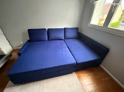 Blue L-shaped sofa bed - converts to double bed, good condition