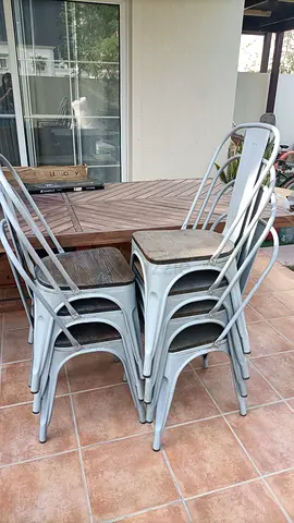 8 wooden stackable metallic chairs