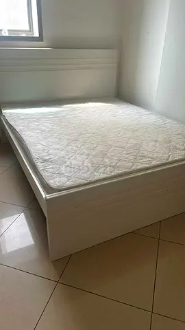 White wooden double bed with headboard - good condition