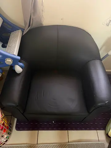 Small black faux leather armchair - good used condition