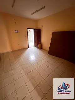 The largest one-bedroom apartment with a living room in Al Butina, featuring a private internal hall