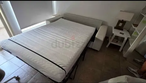 Beige fabric pull-out sofa bed - good condition