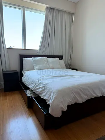 Queen bed frame with storage drawers and mattress - dark wood