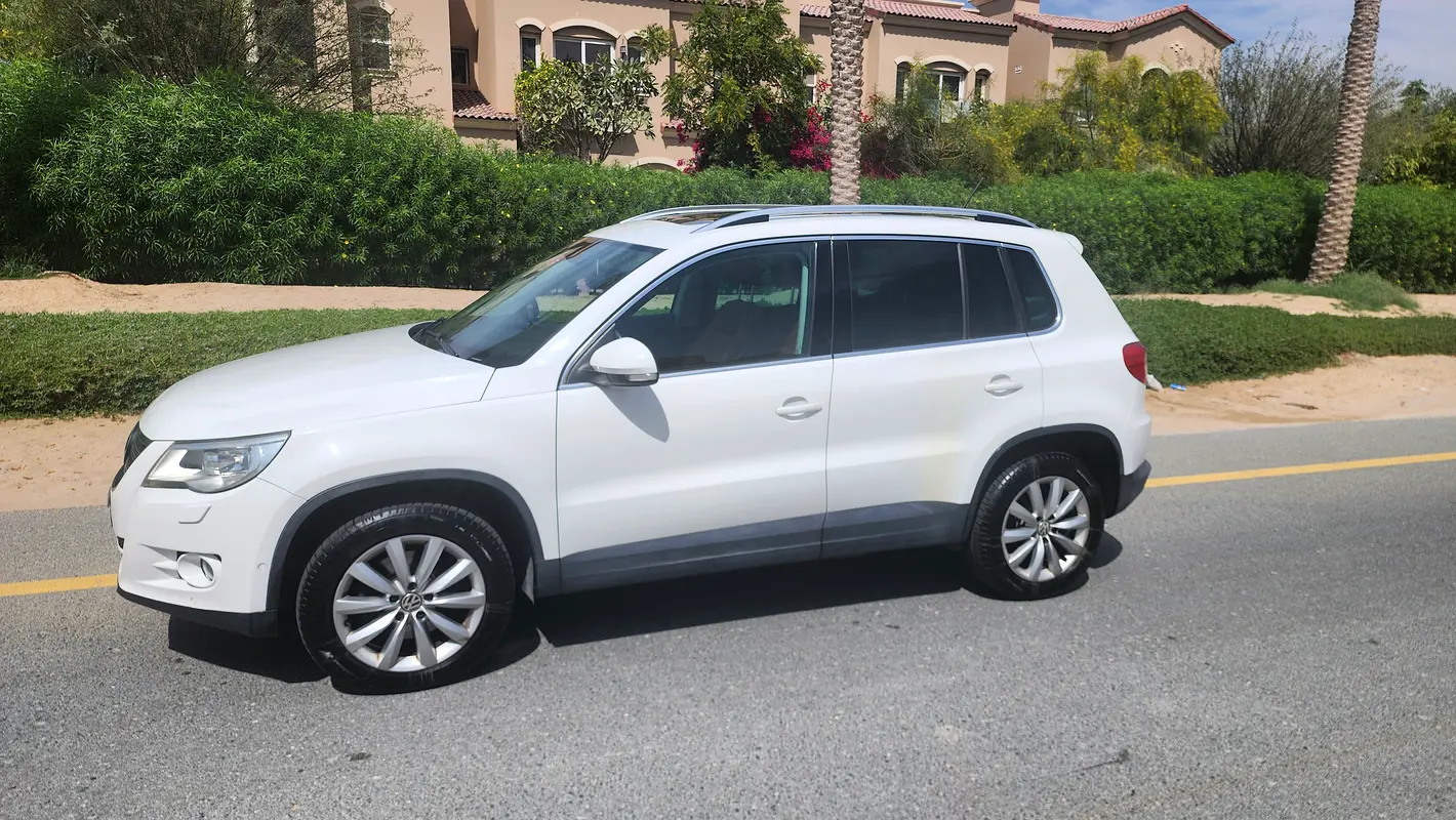 Volkswagen Tiguan 2013 — photo 1 of 11