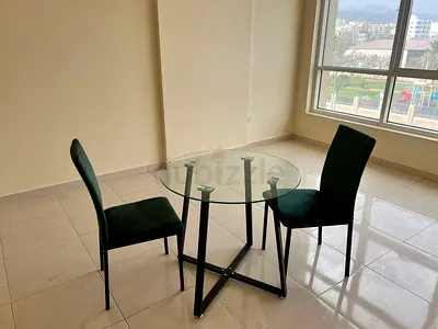 Glass Top Dining Table with Two Dark Green Velvet Chairs - Compact Set