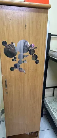 Single-door wooden wardrobe in good used condition