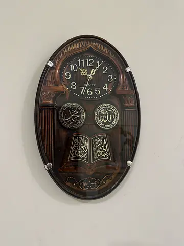 Oval Islamic Wall Clock with Decorative Arabic Calligraphy — Wooden Finish