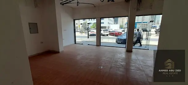 Shop for rent in Al Majaz 1 on a busy street with private bathroom, ideal for various businesses, f