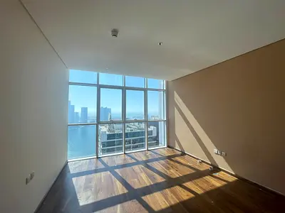 Luxury three-bedroom apartment with a living room for annual rent in Al Taawun, with a sea view, built-in wardrobes, gym, swimming pool, and free park